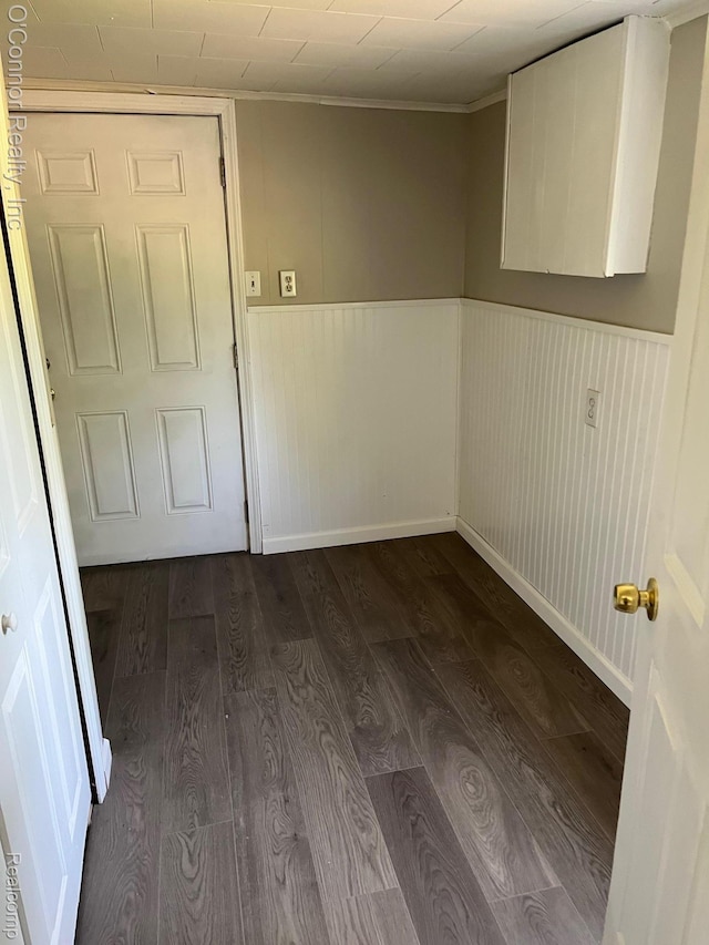 5035 Burma Rd, Kimball, MI 48074 - unfurnished room featuring dark wood finished floors, a wainscoted wall, and ornamental molding