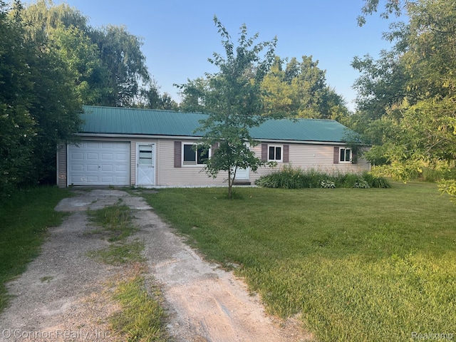 5035 Burma Rd, Kimball, MI 48074 - ranch-style home featuring dirt driveway, a garage, a front yard, and a metal roof
