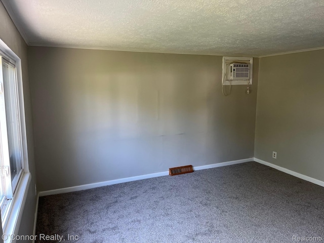 5035 Burma Rd, Kimball, MI 48074 - carpeted empty room with a textured ceiling, a wall mounted air conditioner, and ornamental molding