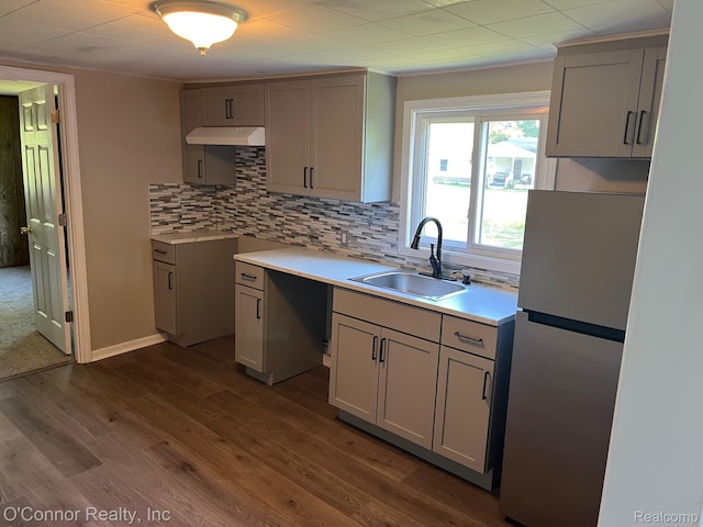 5035 Burma Rd, Kimball, MI 48074 - kitchen with freestanding refrigerator, gray cabinets, backsplash, and dark wood finished floors