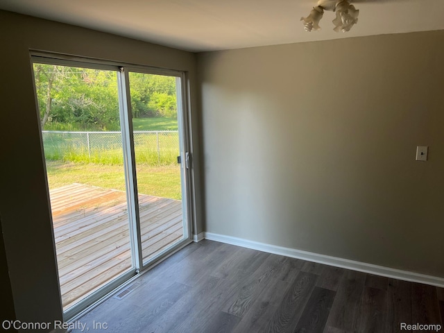 5035 Burma Rd, Kimball, MI 48074 - spare room with dark wood-style floors and baseboards