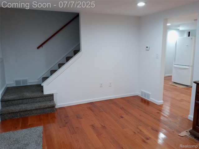 501 N Leroy St, Fenton, MI 48430 - stairs featuring wood finished floors and recessed lighting