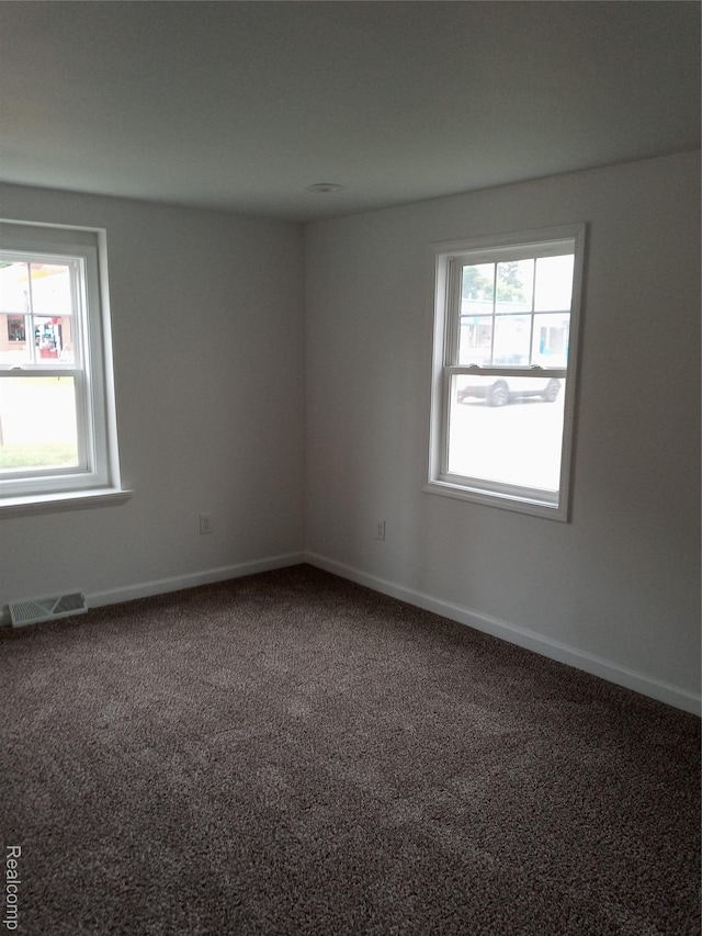501 N Leroy St, Fenton, MI 48430 - carpeted empty room with baseboards