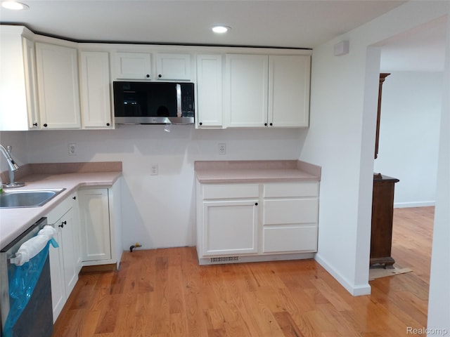 501 N Leroy St, Fenton, MI 48430 - kitchen with stainless steel appliances, white cabinets, light countertops, and recessed lighting