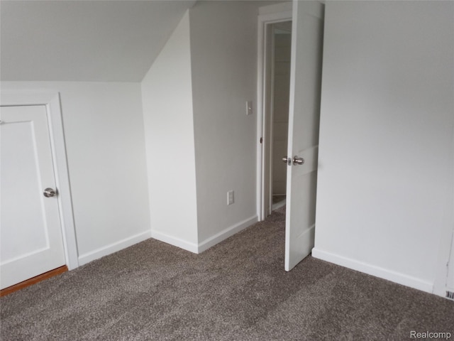 501 N Leroy St, Fenton, MI 48430 - additional living space featuring dark carpet and baseboards