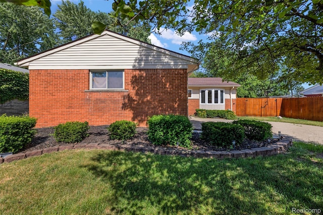 26250 Virginia Dr, Warren, MI 48091 - view of side of home with brick siding