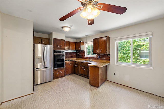 26250 Virginia Dr, Warren, MI 48091 - kitchen with stainless steel appliances, a warming drawer, light floors, and under cabinet range hood