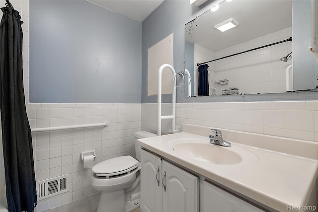 26250 Virginia Dr, Warren, MI 48091 - full bathroom with tile walls, vanity, a shower with curtain, and a wainscoted wall