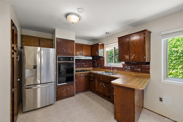 26250 Virginia Dr, Warren, MI 48091 - kitchen with appliances with stainless steel finishes, a warming drawer, healthy amount of natural light, and tasteful backsplash