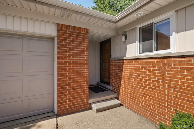 26250 Virginia Dr, Warren, MI 48091 - entrance to property with brick siding, a garage, and board and batten siding