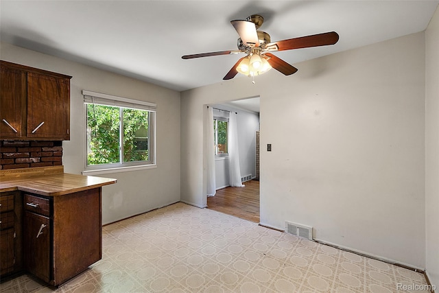 26250 Virginia Dr, Warren, MI 48091 - kitchen featuring light floors, ceiling fan, and dark brown cabinetry