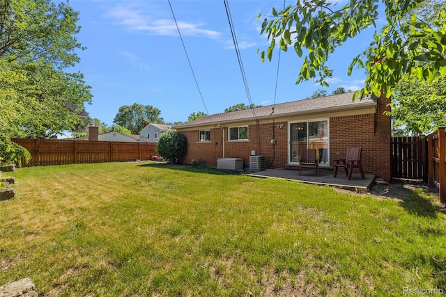 26250 Virginia Dr, Warren, MI 48091 - back of house with a fenced backyard, a patio, and brick siding