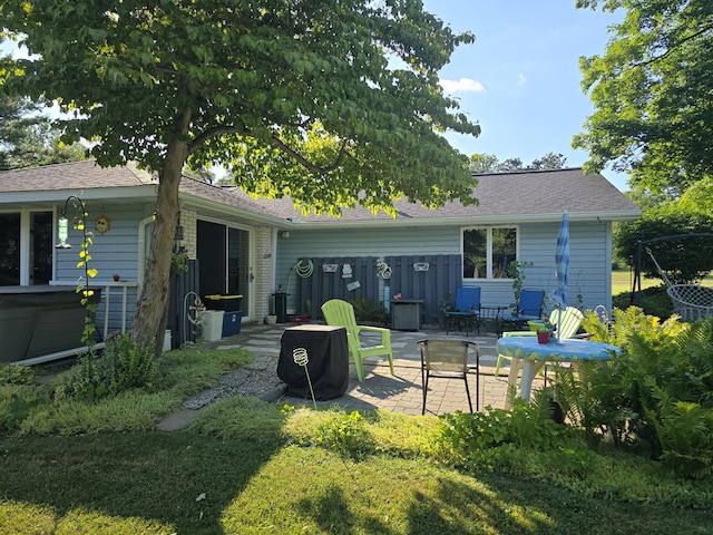 971 Weaver Rd, Bronson, MI 49028 - back of house featuring a patio and a shingled roof
