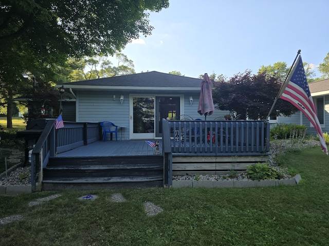 971 Weaver Rd, Bronson, MI 49028 - rear view of house with a lawn and a wooden deck