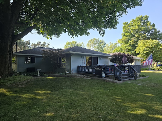 971 Weaver Rd, Bronson, MI 49028 - rear view of property featuring a lawn and a deck