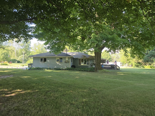 971 Weaver Rd, Bronson, MI 49028 - view of front facade with a front yard and a wooden deck