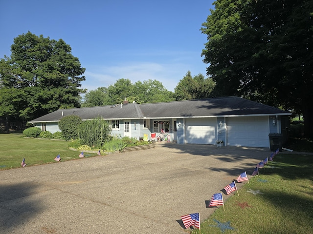 971 Weaver Rd, Bronson, MI 49028 - ranch-style house featuring asphalt driveway, a garage, and a front yard