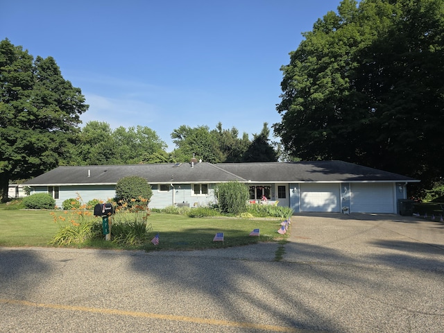 971 Weaver Rd, Bronson, MI 49028 - ranch-style home featuring asphalt driveway, a garage, and a front lawn