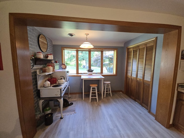 971 Weaver Rd, Bronson, MI 49028 - dining space with light wood-style flooring and baseboards