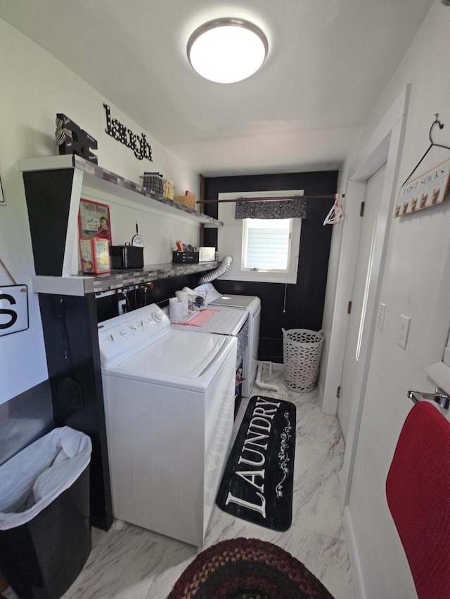 971 Weaver Rd, Bronson, MI 49028 - laundry area featuring washer and dryer and marble finish floors