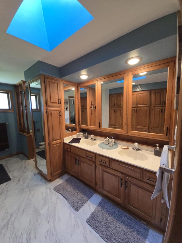 971 Weaver Rd, Bronson, MI 49028 - bathroom with double vanity and marble look tiles
