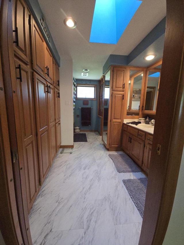 971 Weaver Rd, Bronson, MI 49028 - bathroom with vanity, marble finish floors, and recessed lighting