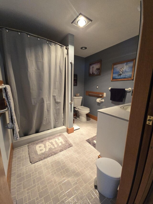 971 Weaver Rd, Bronson, MI 49028 - bathroom with vanity, brick patterned floors, and a shower stall