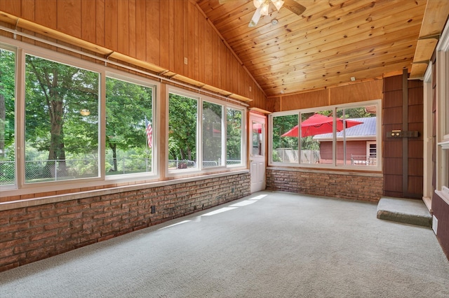 1834 Bond St, Niles, MI 49120 - unfurnished sunroom with lofted ceiling, brick wall, carpet, wooden ceiling, and wood walls