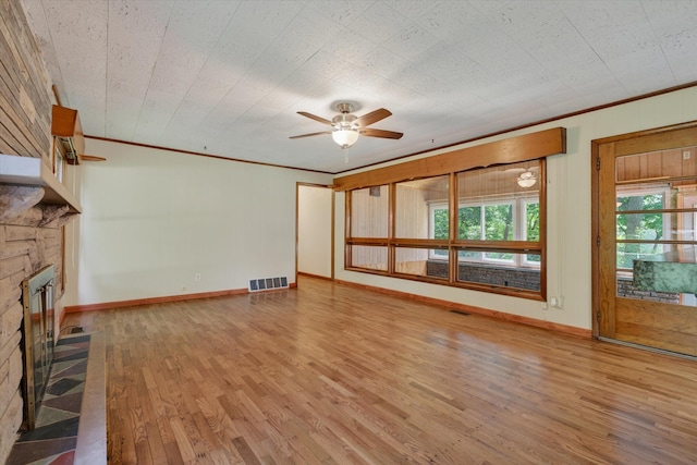 1834 Bond St, Niles, MI 49120 - unfurnished living room featuring a fireplace, wood finished floors, ceiling fan, and ornamental molding