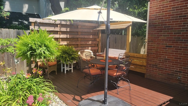 401 Budlong St, Adrian, MI 49221 - wooden terrace with outdoor dining area