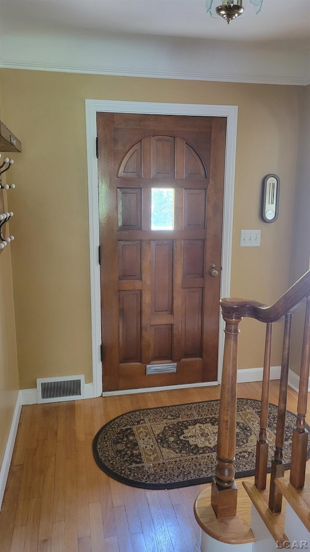 401 Budlong St, Adrian, MI 49221 - entryway featuring hardwood / wood-style flooring and baseboards