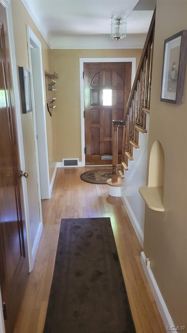 401 Budlong St, Adrian, MI 49221 - entrance foyer with light wood-style flooring and baseboards