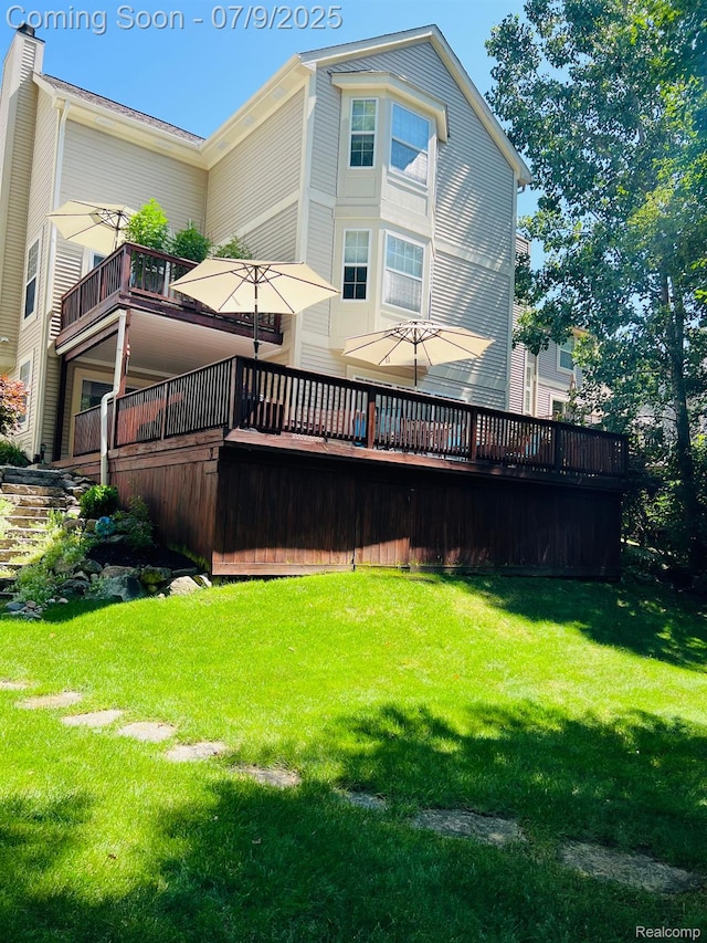 5348 Forest Ridge Dr, Clarkston, MI 48346 - rear view of house featuring a lawn and a deck