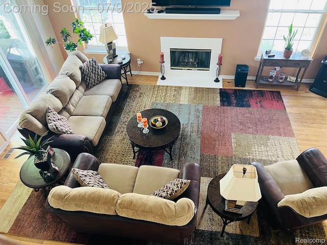 5348 Forest Ridge Dr, Clarkston, MI 48346 - living room with wood finished floors and a glass covered fireplace