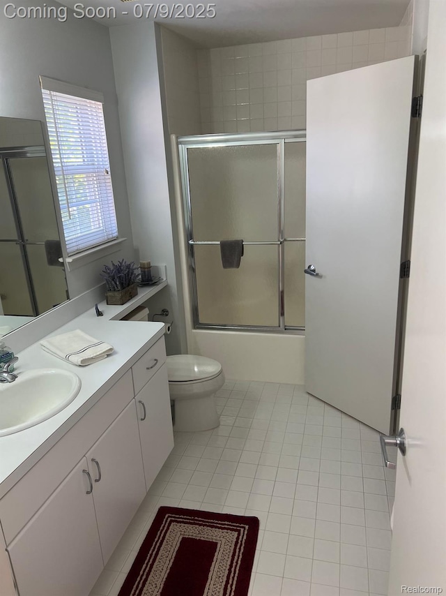 5348 Forest Ridge Dr, Clarkston, MI 48346 - bathroom featuring vanity, tile patterned floors, and bath / shower combo with glass door