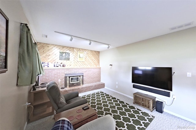 9100 Mayfred Dr, Pinckney, MI 48169 - carpeted living room featuring track lighting and a fireplace