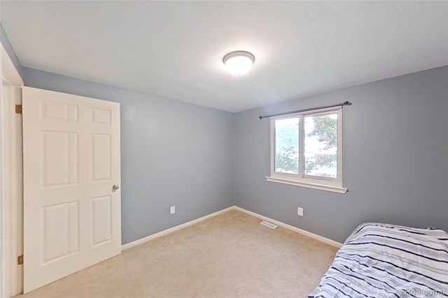 9100 Mayfred Dr, Pinckney, MI 48169 - unfurnished bedroom with light colored carpet and baseboards
