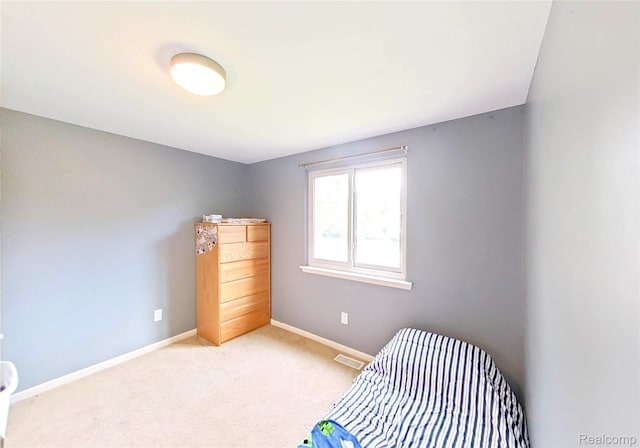 9100 Mayfred Dr, Pinckney, MI 48169 - bedroom with baseboards and light colored carpet