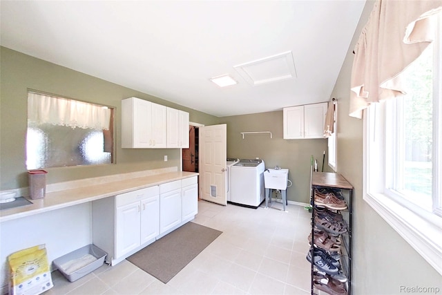 9100 Mayfred Dr, Pinckney, MI 48169 - laundry area featuring washing machine and clothes dryer, attic access, and light tile patterned floors