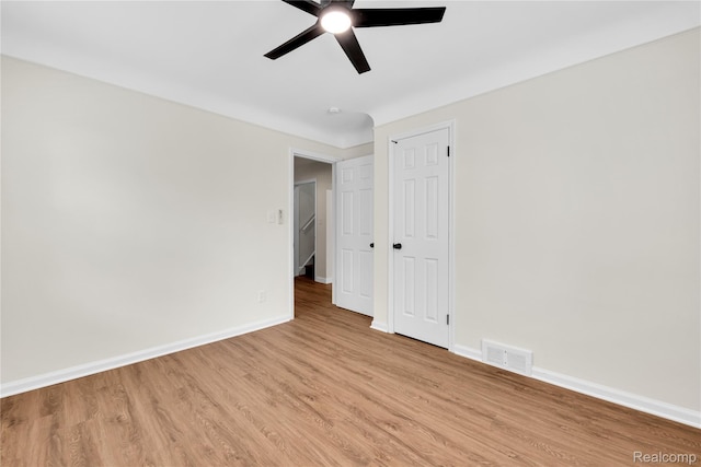 3992 Devonshire Rd, Detroit, MI 48224 - unfurnished bedroom featuring light wood finished floors, a ceiling fan, and a closet