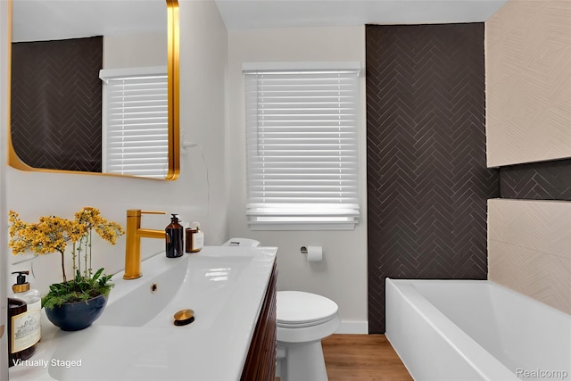 3992 Devonshire Rd, Detroit, MI 48224 - bathroom with a bath, vanity, and wood finished floors