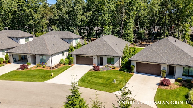 2063 Ottawa Beach Rd, Holland, MI 49424 - view of front of house featuring driveway, a shingled roof, and a front yard