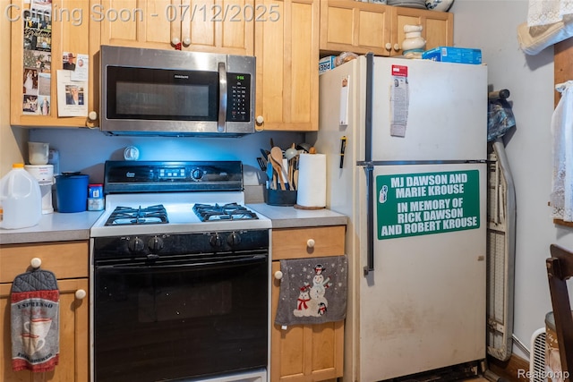 16380 Sumpter Rd, Van Buren, MI 48111 - kitchen with white appliances, light countertops, and light brown cabinets