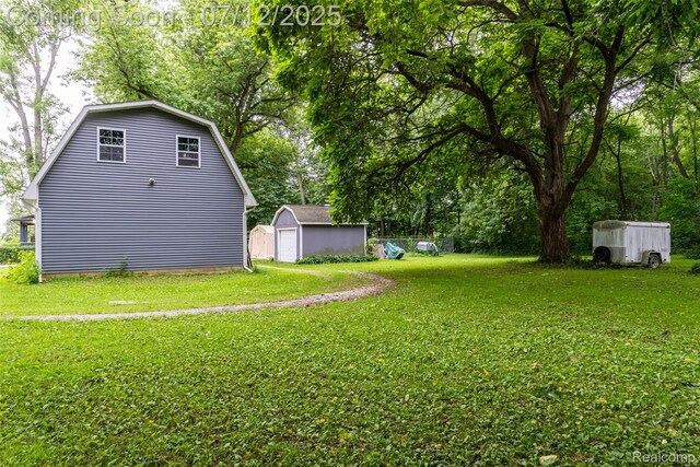 16380 Sumpter Rd, Van Buren, MI 48111 - view of grassy yard with a storage unit