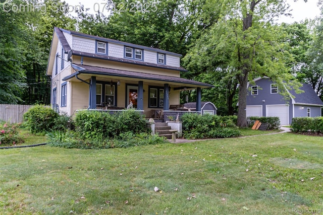 16380 Sumpter Rd, Van Buren, MI 48111 - view of front facade with covered porch and a detached garage