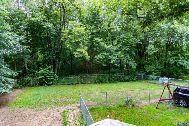 16380 Sumpter Rd, Van Buren, MI 48111 - view of yard with a wooded view