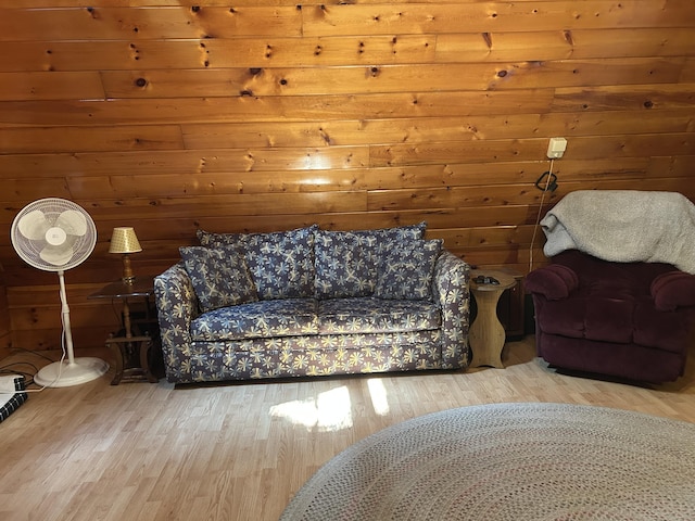 3423 S James Rd, Baldwin, MI 49304 - living room featuring wood finished floors and wood walls
