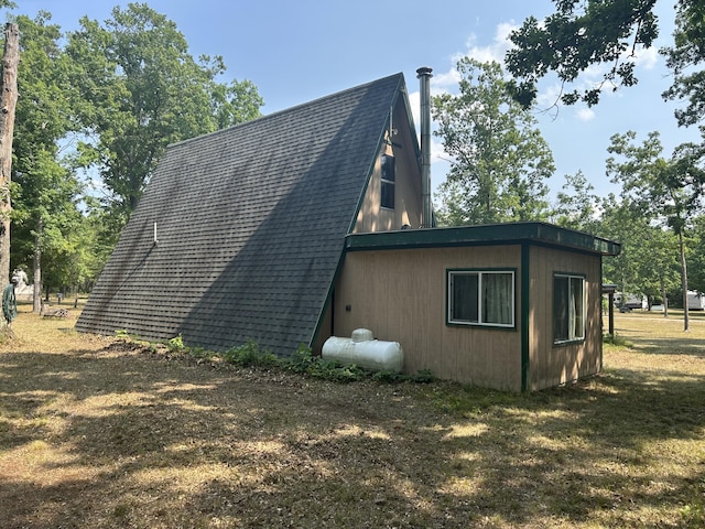 3423 S James Rd, Baldwin, MI 49304 - view of home's exterior featuring roof with shingles
