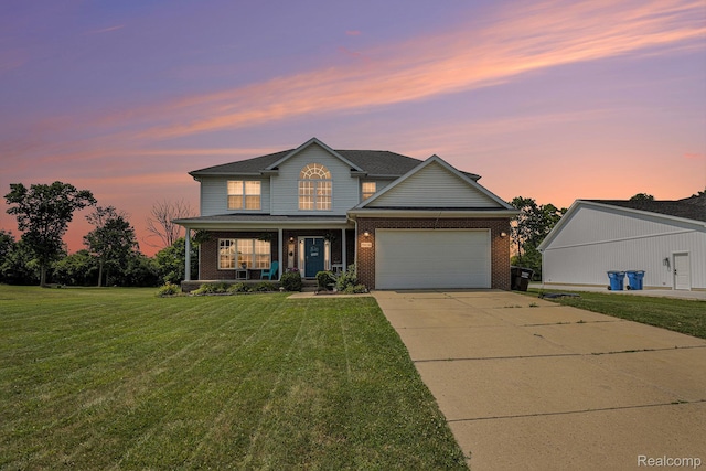 5304 Boomerang Cir, Newport, MI 48166 - view of front facade featuring covered porch, driveway, a front lawn, brick siding, and a garage