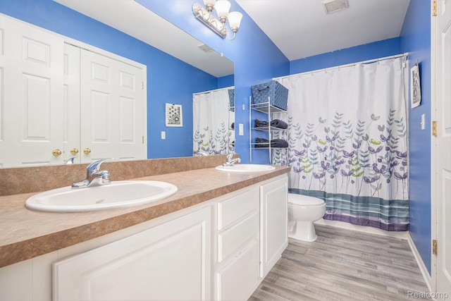 5304 Boomerang Cir, Newport, MI 48166 - bathroom with double vanity, wood finished floors, and a shower with shower curtain